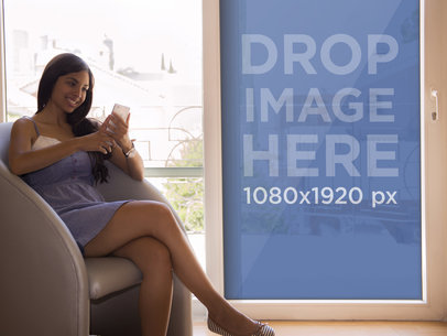 iPhone Mockup of Young Woman Sitting by the Window 