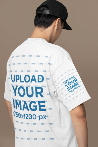 Back-View Mockup of a Man Wearing an Oversized T-Shirt in a Studio