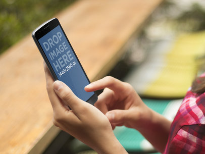 Mockup Template of Woman Using Android in Terrace