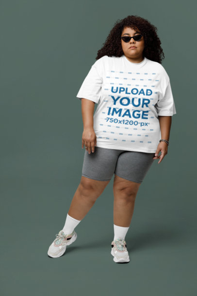 Mockup of a Woman with Curly Hair Wearing a Plus Size T-Shirt and Sunglasses