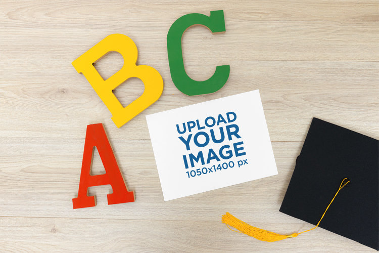 Mockup of a Diploma Placed Next to Decorative Items for a Kids' Graduation