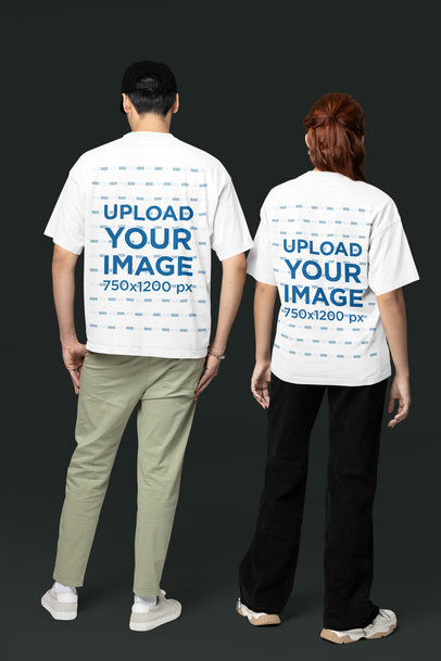 Back-View Oversized T-Shirt Mockup Featuring a Man and Woman Standing in a Studio