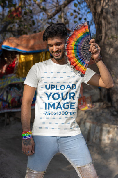 Scott International Tee Mockup of a Man Holding a Rainbow Hand Fan for Pride Month