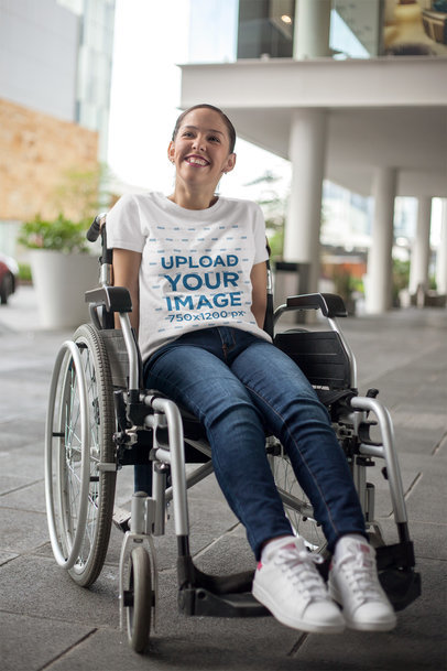 Mockup of a Happy Woman Wearing a T-Shirt Sitting on a Wheelchair
