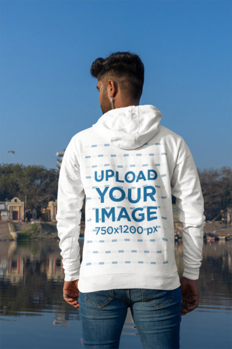 Back-View Gildan Hoodie Mockup of a Man Standing by a Lake