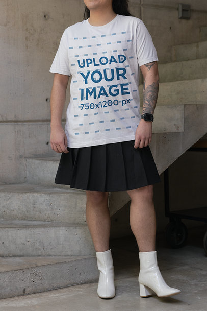Bella Canvas T-Shirt Mockup Featuring a Tattooed Person Posing by a Staircase