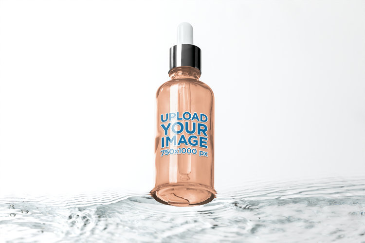 Mockup of a Beauty Dropper Placed Over Water