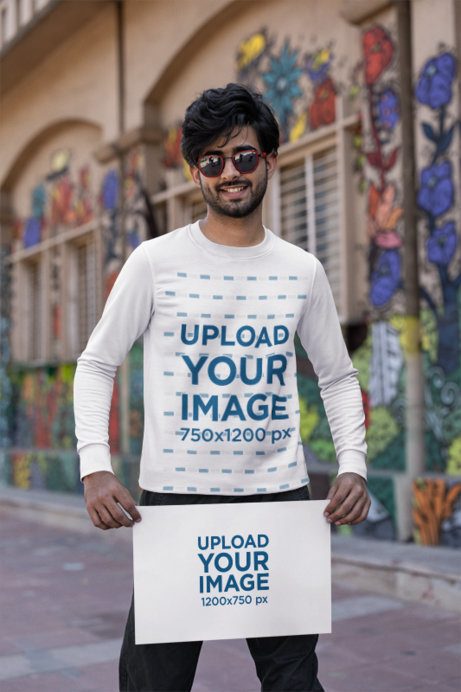 Mockup of a Happy Man Wearing a Crewneck Sweatshirt and Holding a Flyer