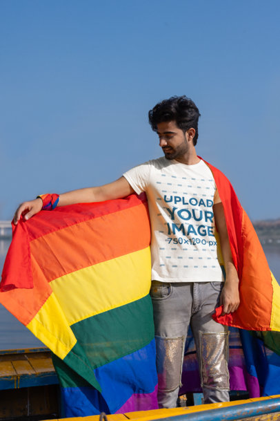 Scott International Tee Mockup of a Bearded Man Carrying a Rainbow Flag for Pride Month