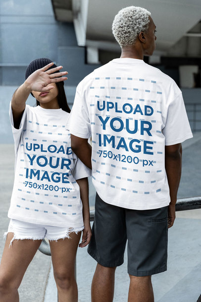 Mockup Featuring a Man and a Woman Wearing Matching Oversized T-Shirts