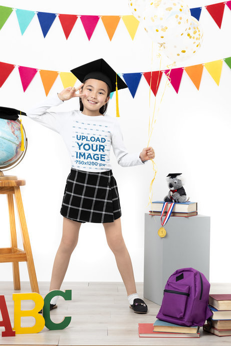 Mockup of a Happy Girl Wearing a Long Sleeve Tee to Celebrate Her Graduation