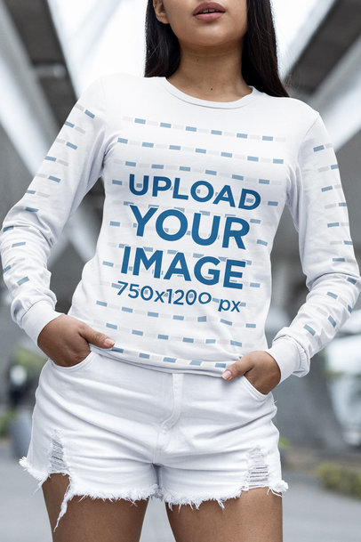 Mockup of a Woman Wearing a Round-Neck Bella Canvas Tee with Long Sleeves