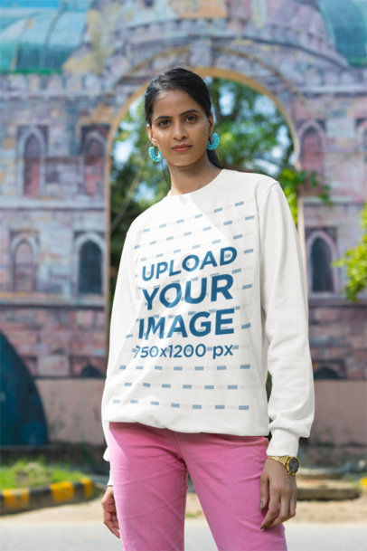 Sweatshirt Mockup of a Woman Posing in the Street With a Serious Expression