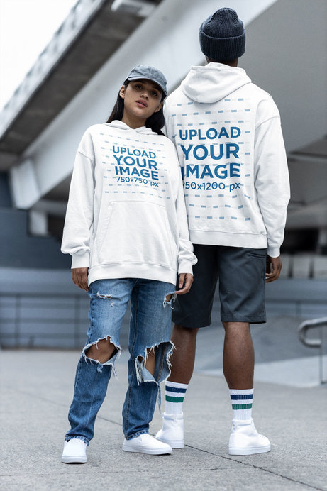Streetwear Mockup of a Man and a Woman Wearing Oversized Gildan Hoodies