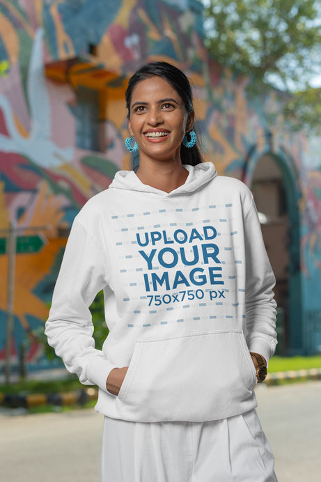 Gildan Pullover Hoodie Mockup Featuring a Woman With a Joyful Look on the Street