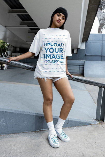 Oversized T-Shirt Mockup of a Serious Woman in the Street Wearing Sneakers m38284