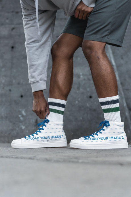 Mockup of a Man Touching His Sneakers