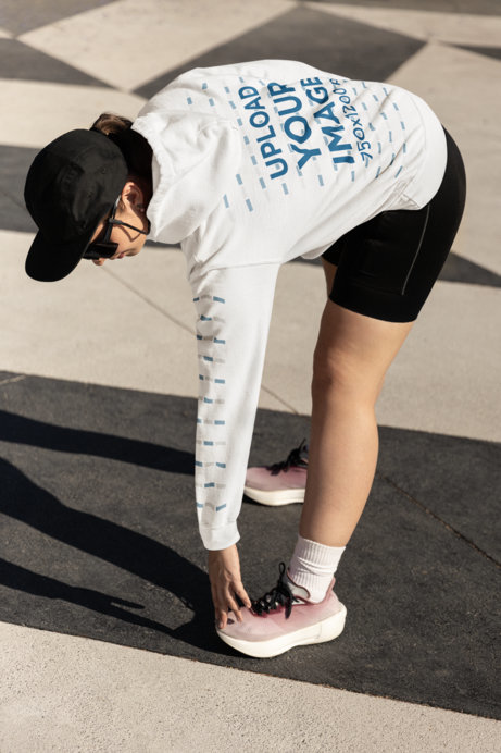 Gildan Hoodie Mockup of a Woman Stretching Before Running