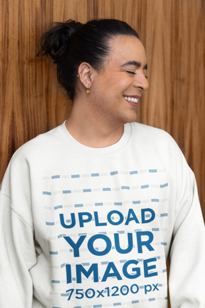 Gildan Sweatshirt Mockup Featuring a Happy Person Posing Against a Wooden Wall