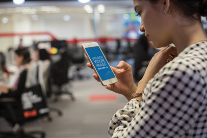iPhone Mockup Featuring a Woman at a Call Center