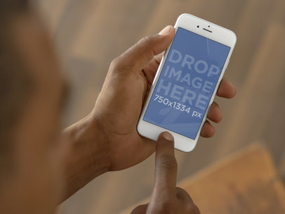 Close-up Shot of Man Using a White iPhone 6 Mockup