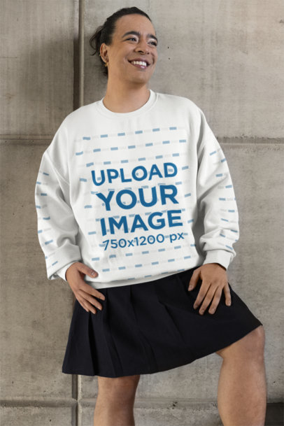 Gildan Sweatshirt Mockup of a Happy Person Leaning Against a Concrete Wall