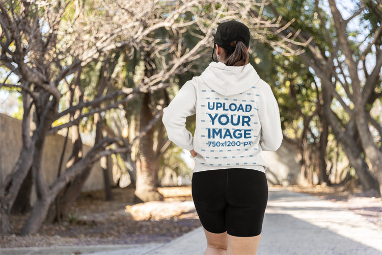 Running-Themed Mockup of the Back-View of a Woman Wearing a Gildan Hoodie