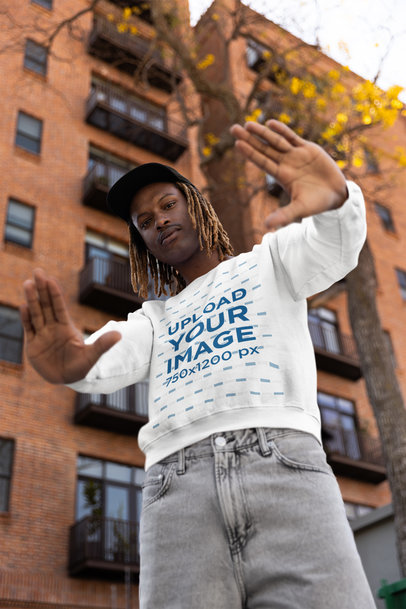 Hip Hop-Inspired Sweatshirt Mockup of a Man Doing Framing Gestures with His Hands
