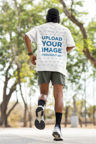 Back-View Oversized Tee Mockup Featuring a Man Jogging in a Park