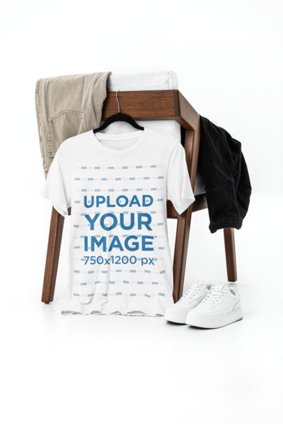 Mockup of a Bella Canvas T-Shirt Placed on a Hanger Featuring an Outfit Set