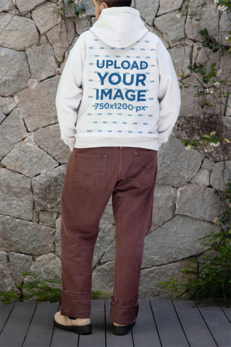 Gildan Mockup Featuring the Back-View of a Person Wearing a Pullover Hoodie