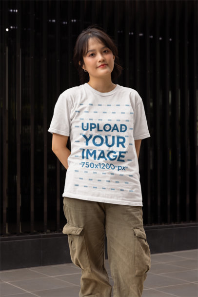 Gildan Tee Mockup of a Woman Standing in the Street With a Happy Look