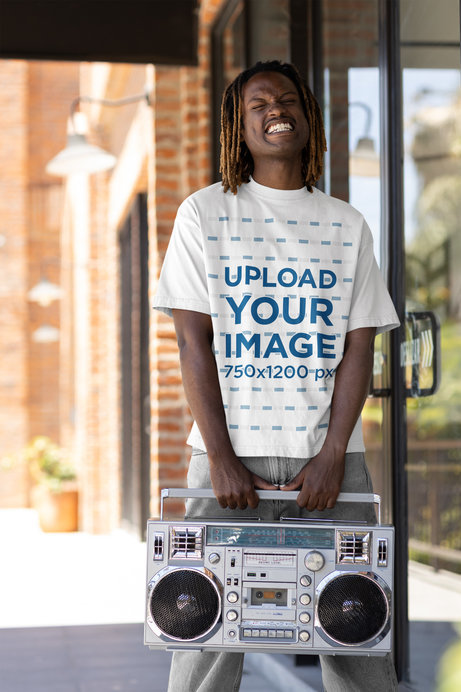 Hip Hop-Inspired T-Shirt Mockup of a Happy Man Holding a Retro Boombox