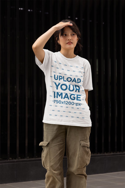 Gildan Tee Mockup of a Woman Looking at Something in the Street
