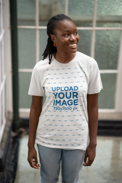 Bella Canvas T-Shirt Mockup of a Cheerful Woman Posing Against a Window