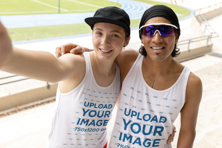 Bella Canvas Tank Top Mockup of a Smiling Woman and Man Taking a Selfie on a Running Track