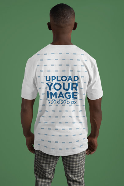 Back-View Bella Canvas T-Shirt Mockup of a Man Standing in a Studio