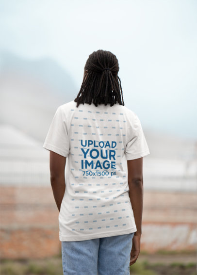 Back-View Mockup of a Woman Wearing a Bella Canvas T-Shirt