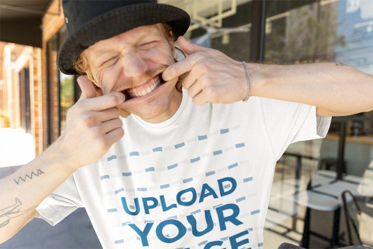 Oversized T-Shirt Mockup of a Funny Man Making a Hilarious Face and Wearing a Hip-Hop Style