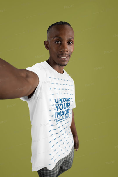Bella Canvas T-Shirt Mockup of a Smiling Man Taking a Selfie in a Studio