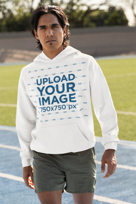 Gildan Pullover Hoodie Mockup of a Runner Standing on a Track