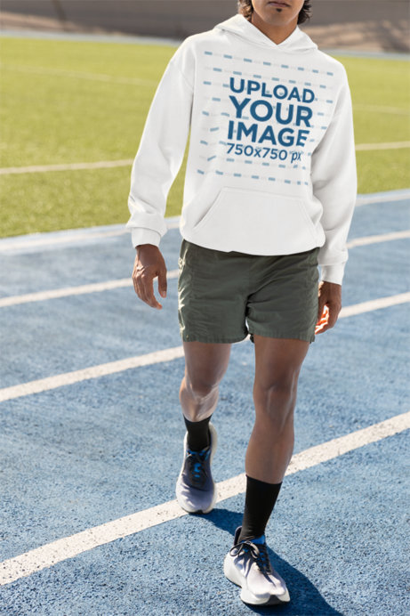 Gildan Pullover Hoodie Mockup Featuring a Man on a Running Track