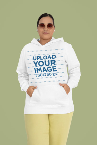 Gildan Hoodie Mockup Featuring a Woman With a Smiley Look in a Studio