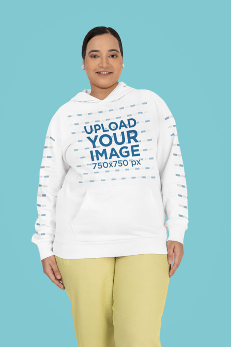 Gildan Pullover Hoodie Mockup of a Happy Woman Standing in a Studio With a Colorful Background