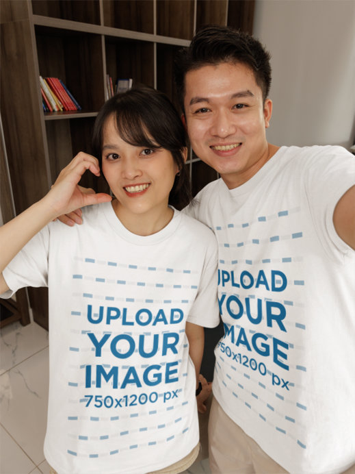 Mockup of a Man and a Woman Taking a Selfie with Matching Gildan T_Shirts