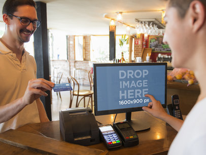 Man Making a Sales Transaction at a Restaurant Using LG Monitor