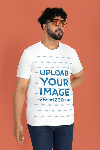 Mockup Featuring a Bearded Man with Sunglasses Wearing a T-Shirt in a Studio