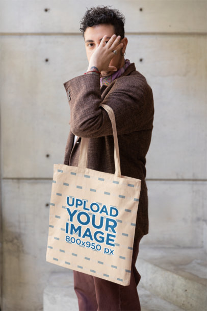 Mockup of a Person with a Hand Tattoo Carrying a Tote Bag m39044