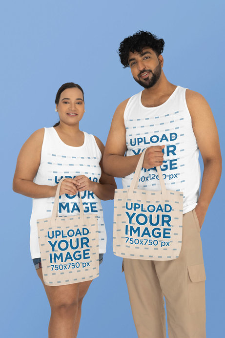 Mockup of a Man and a Woman Wearing Plus Size Tank Tops and Holding Tote Bags