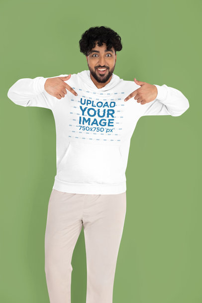 Gildan Mockup Featuring a Cheerful Bearded Man Pointing at His Hoodie in a Studio